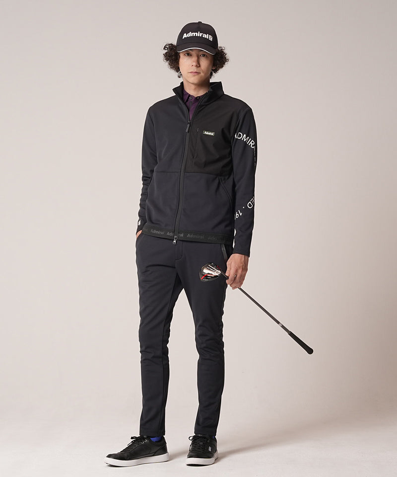 袖のアーチロゴがポイントのジャケットの黒の前